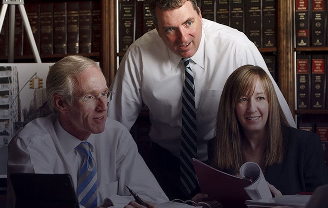 Photo of attorneys at The Law Firm of Connors & Connors, P.C.